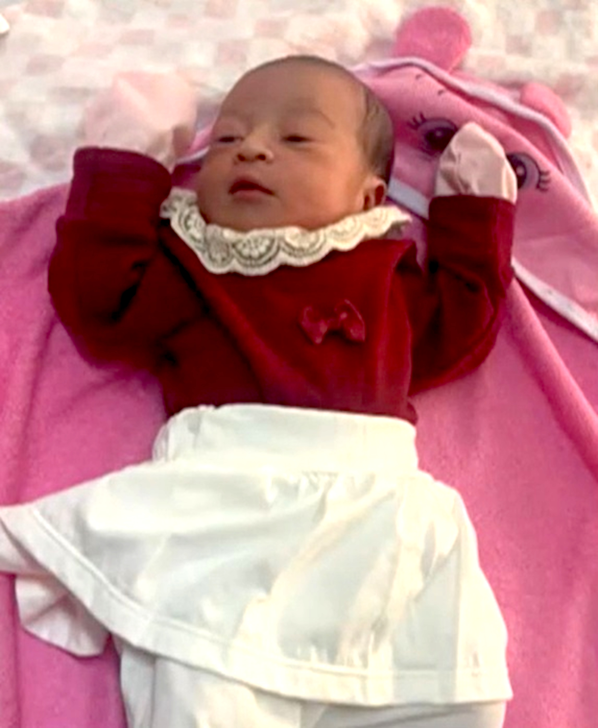 Picture shows baby Ana Beatriz, undated. Her body was found wrapped in a plastic bag inside a cupboard with cleaning products in Novo Lino, Brazil. Note: Private photo taken from local media. Ana Beatriz