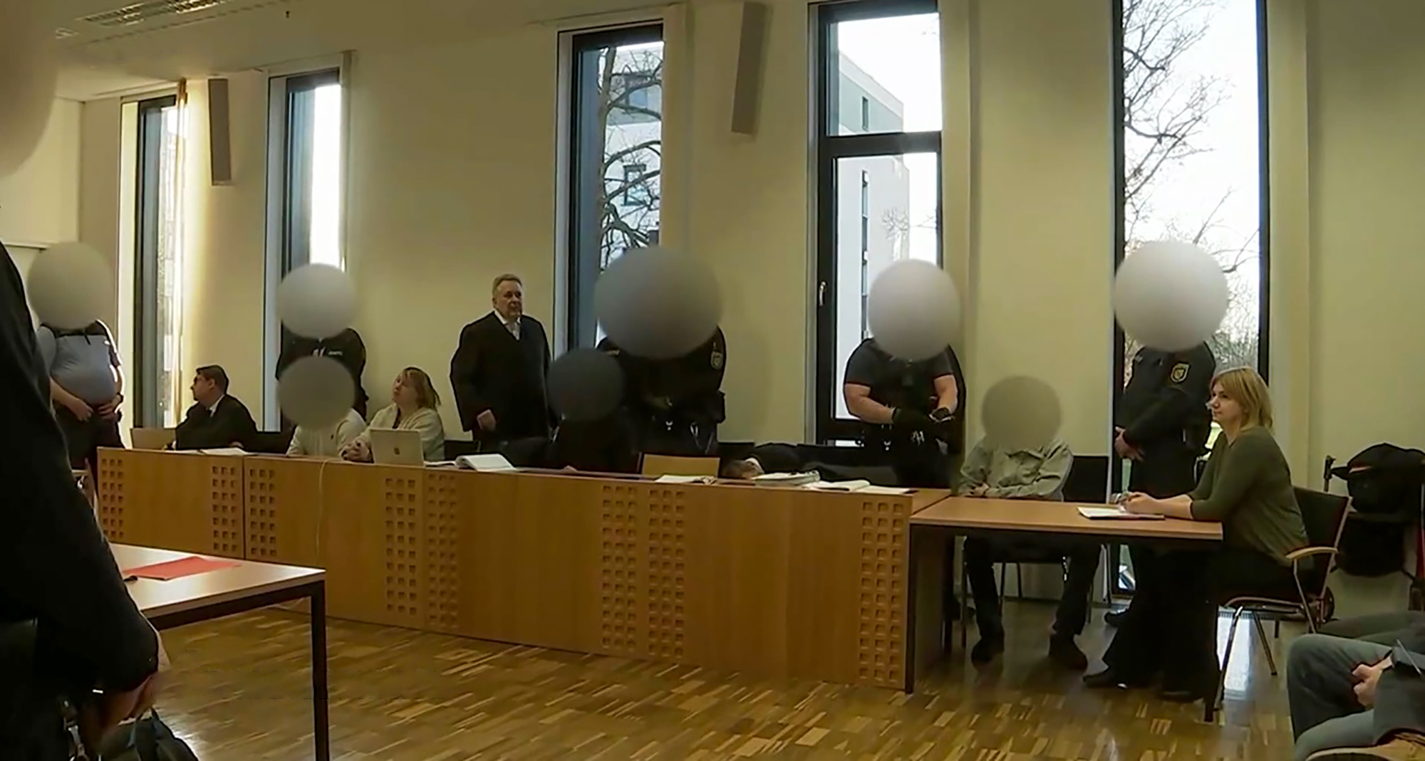 Image shows the three defendants, undated photo. They stole a female monkey (Macaca silenus) named Ruma, 15, from Leipzig Zoo, Germany. Note: Photo is a screenshot from a video. three defendants