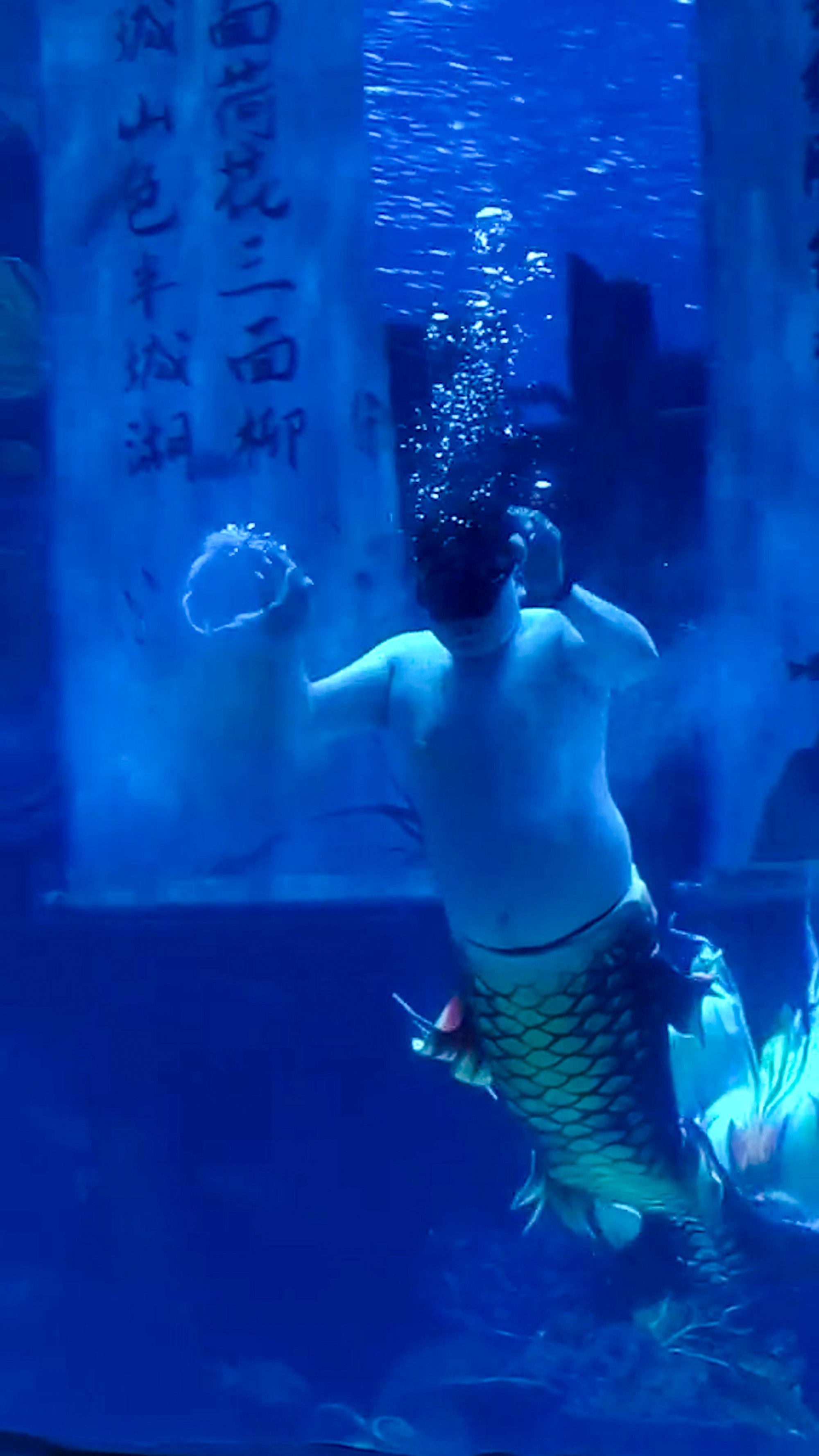 Chubby mermaid performs in Sunac Ocean World in Jinan, China, undated. The video 1 was shared on Douyin - the Chinese version of TikTok on April 19, 2025 and the video 2 on April 21, 2025. Note: Photo is a screenshot from a video. Chubby mermaid