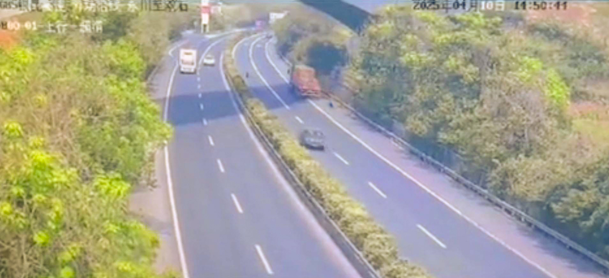 Truck tire rolls on highway and knocks down a woman killing her in Chongqing, China, April 10, 2025. The accident is under investigation. Note: Photo is a screenshot from a video Truck tire rolls on highway and knocks down a woman