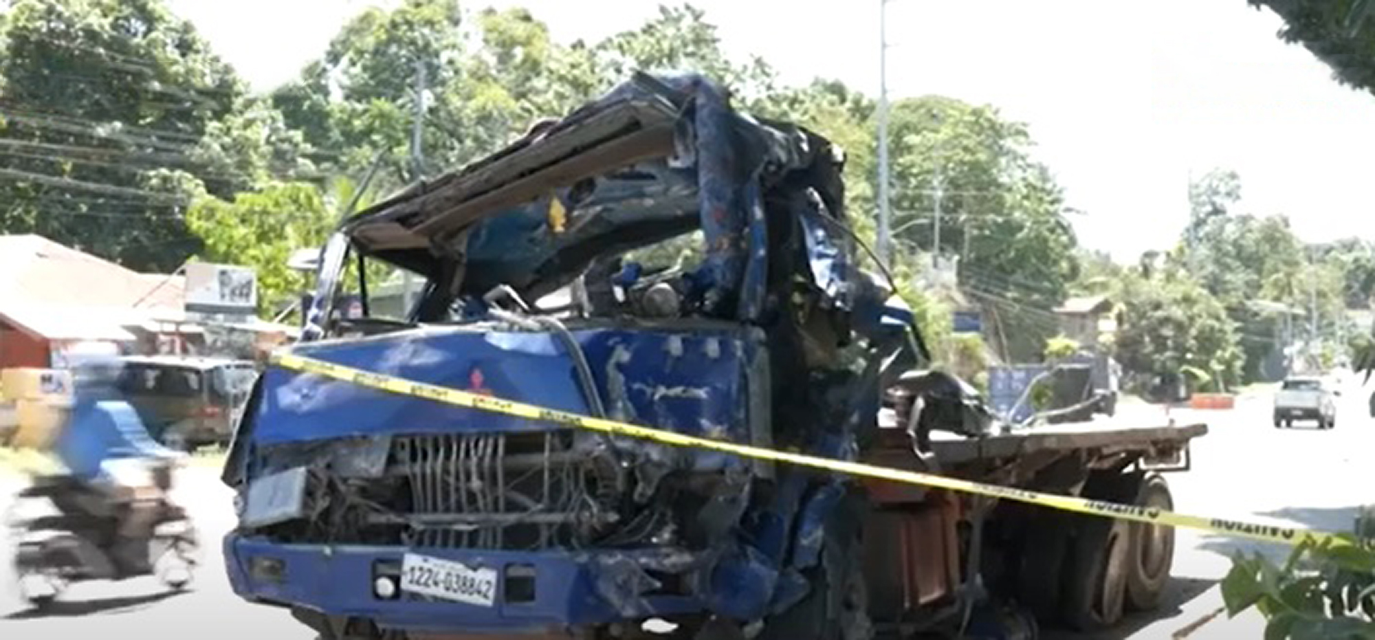 Picture shows the crashed truck, undated. A cargo truck flipped onto its side in Alubijid, Philippines. Note: Image is a screenshot from video. Crashed truck