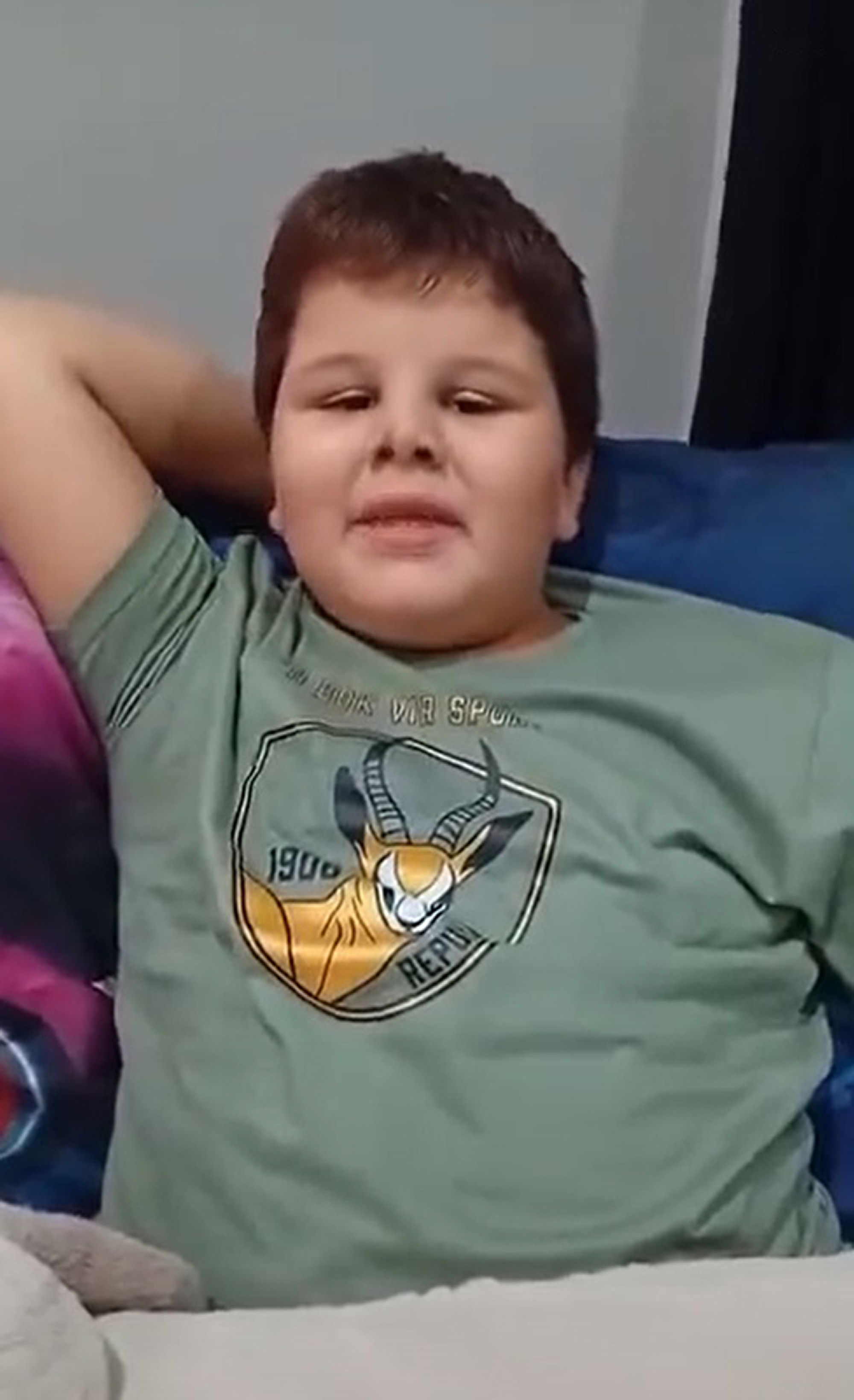 Picture shows seven-year-old Johandre Blom recovering after crocodile attack near Brits, South Africa. He lost his arm. Note: Image is a screenshot from video. Johandre Blom