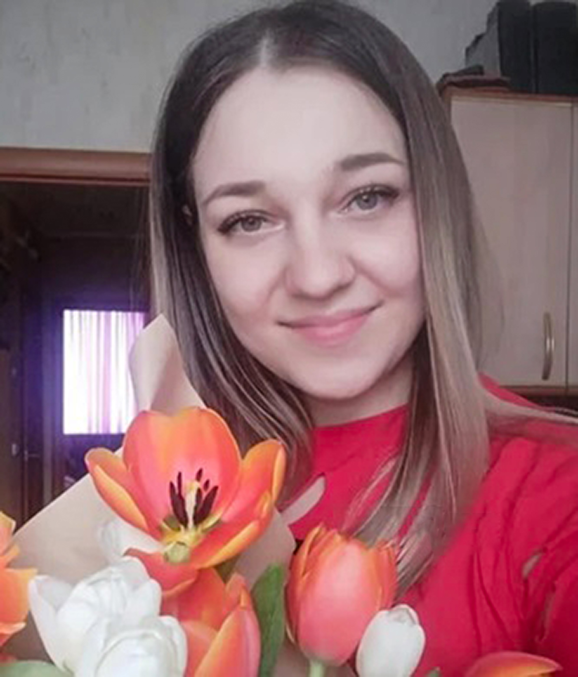 Olga Guzikova, 34, poses in undated photo. Doctors broke her baby's shoulder during childbirth and it later died in Blagoveshchensk, Russia. Note: Private photo taken from local media. Olga Guzikova