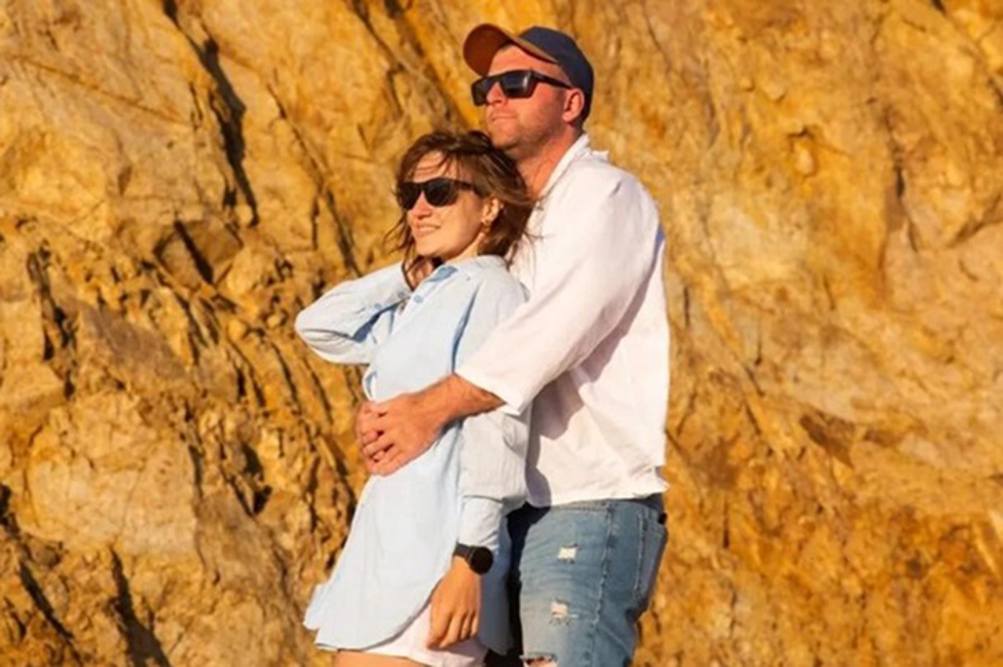 Olga Guzikova, 34, poses with husband in undated photo. Doctors broke her baby's shoulder during childbirth and it later died in Blagoveshchensk, Russia. Note: Private photo taken from local media. Olga Guzikova