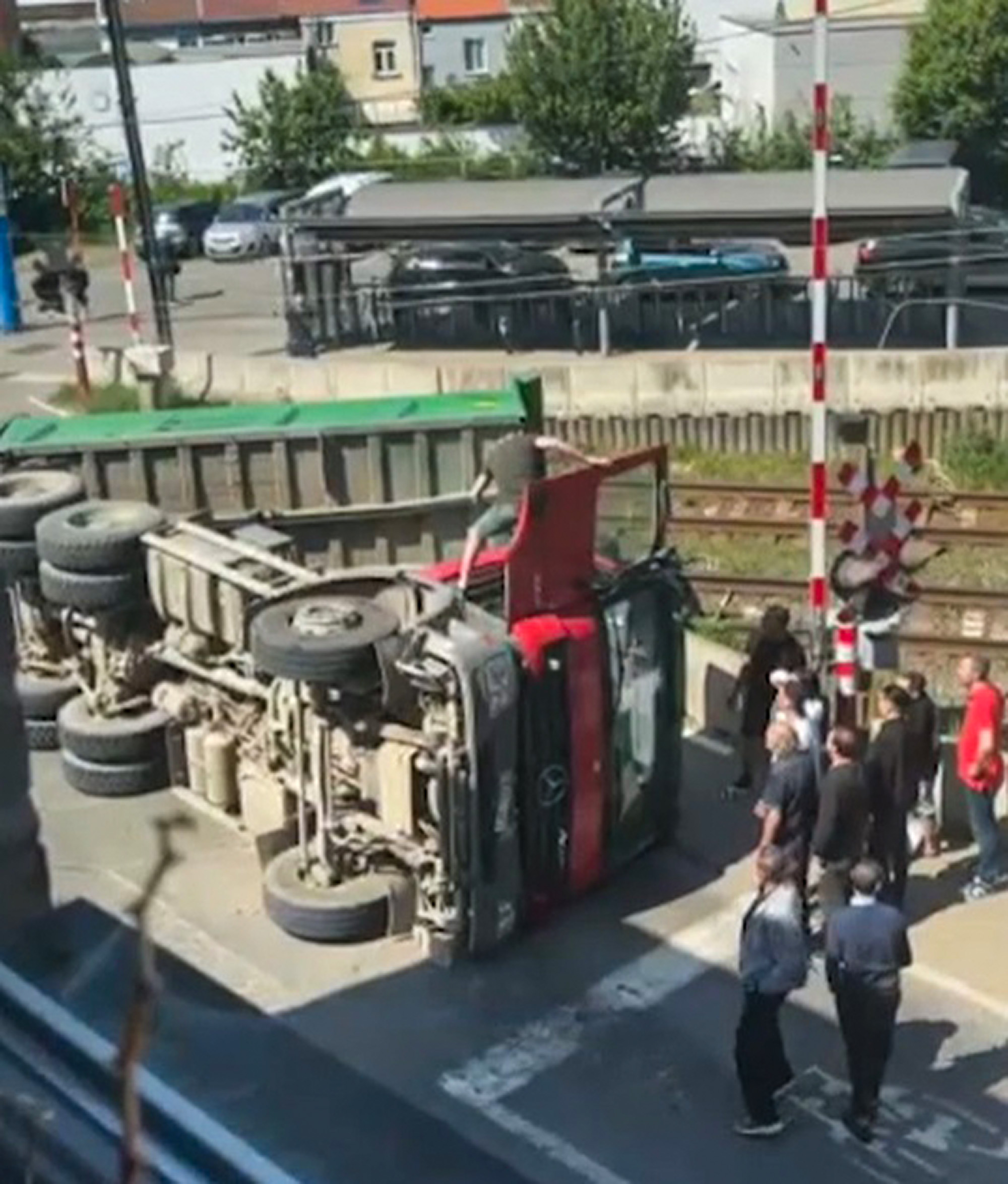 Picture shows the scene of the accident in Groot-Bijgaarden, Belgium, April 30, 2025. Belgian truck overturned after hitting wires at railway. Note: Image is a screenshot from video. The scene of the accident
