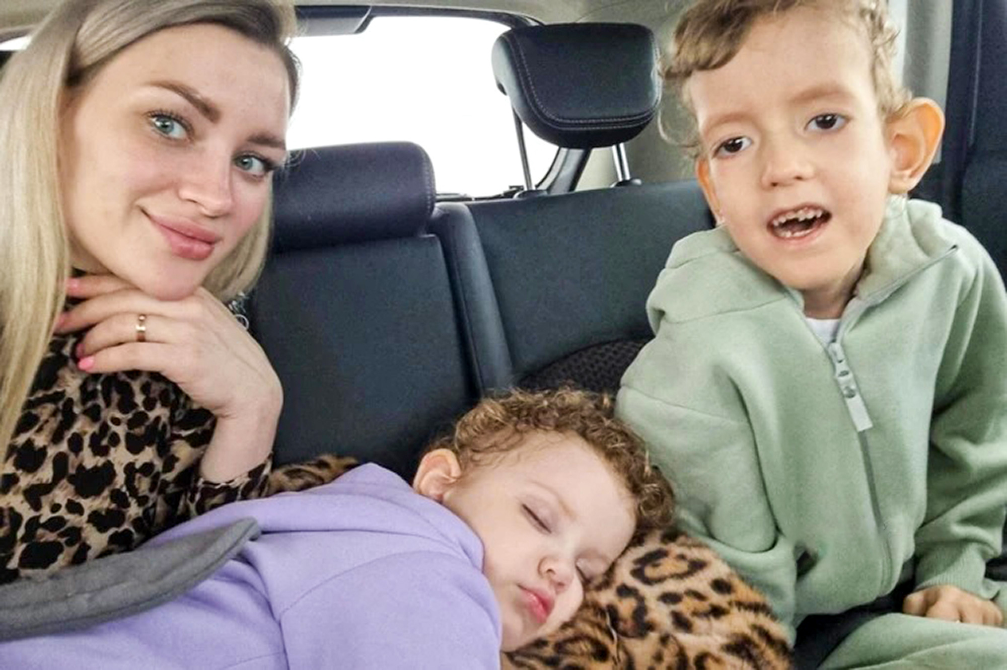 Picture shows Sasha Dzhanelidze with his mother Karolina and his little sister, undated. He died in the Amur Regional Children's Hospital, Russia, in May 2023. Note: Private photo taken from local media. Sasha Dzhanelidze with his mother Karolina and his little sister