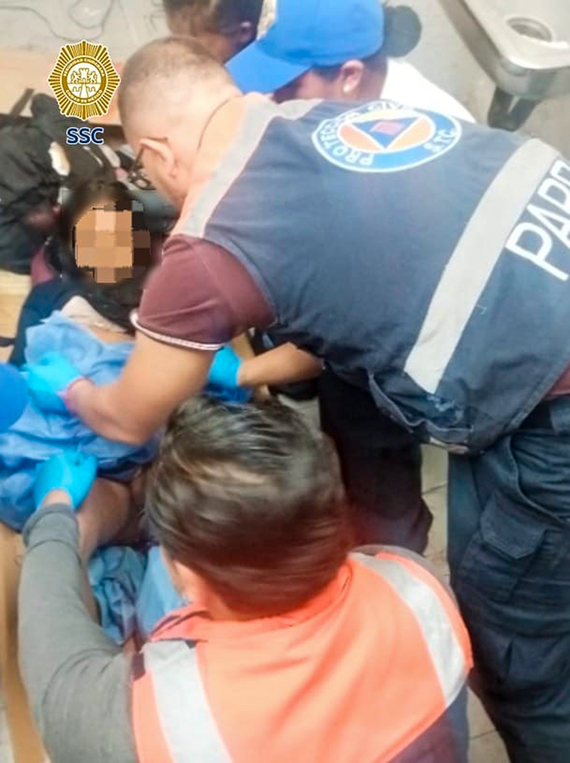 Picture shows the 13-year-old giving birth, undated. The teenager gave birth in a subway in Mexico City, Mexico, on May 10, 2025. Note: Police photo. Picture shows the 13-year-old giving birth