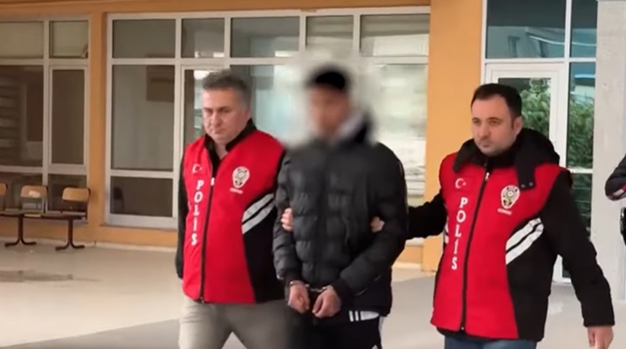 Picture shows the suspect (middle), undated. He allegedly killed Gulden Coni. Note: Image is a screenshot from video. Gulden Coni