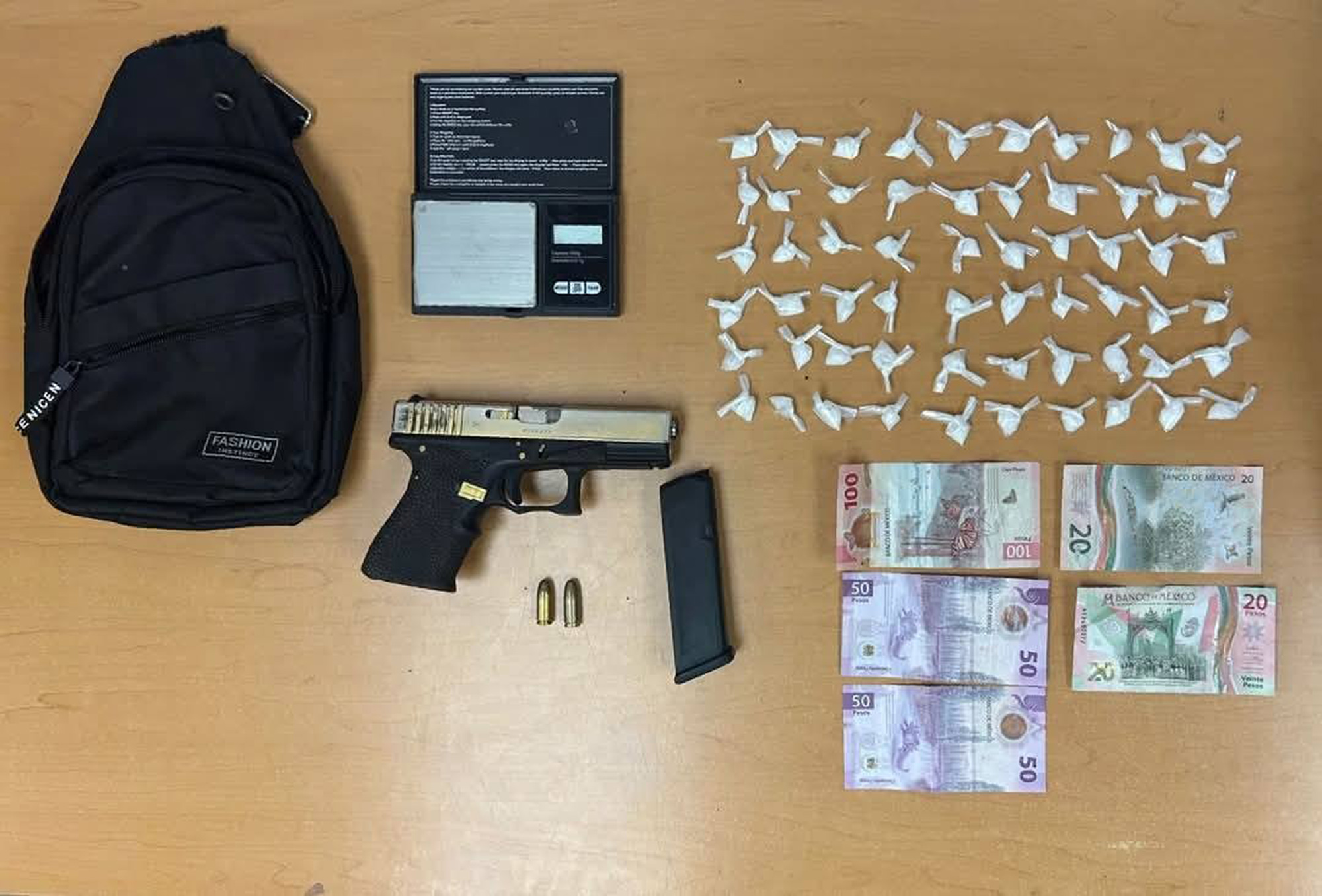 Picture shows the seized items, undated. A 19-year-old man named Brad Pitt was captured and found with weapons and drugs in his possession in Monterrey, Mexico. Note: Police photo taken from social media. the seized items