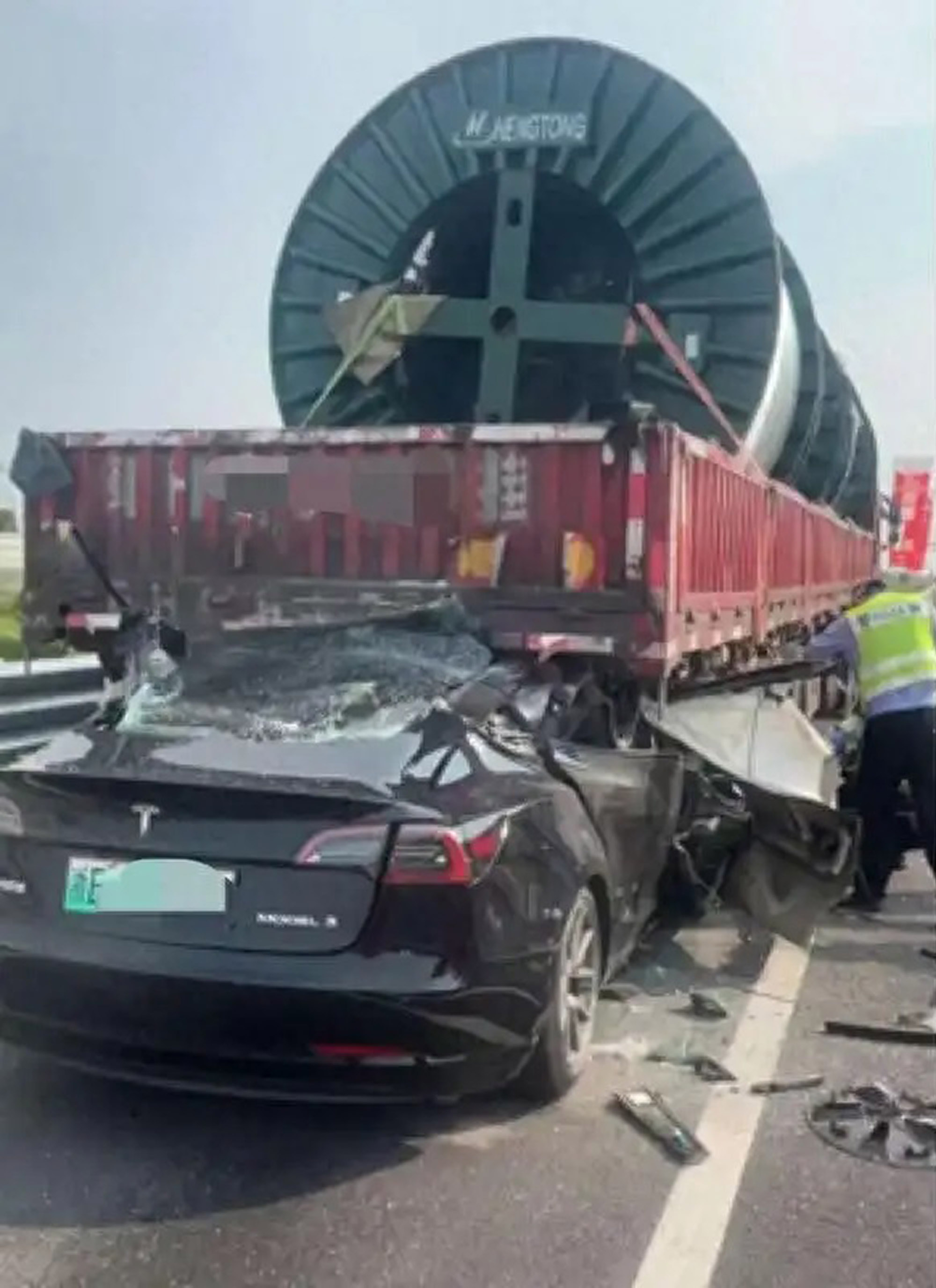 Picture shows the scene where Tesla crashed into truck at high speed in Huzhou, Zhejiang in China, May 25, 2025. The driver died on spot. Note: Private photo. Tesla crashed into truck at high speed