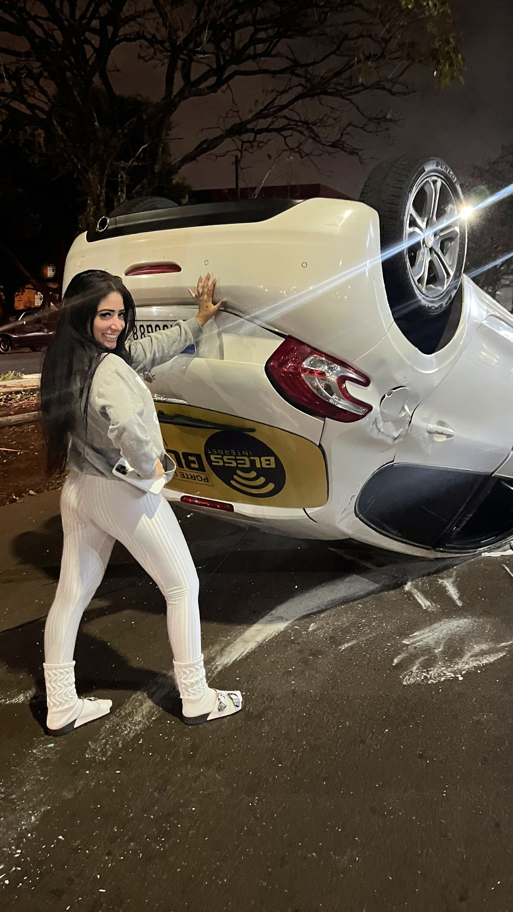 nfluencer Kayla Gabrielle poses with overturned car after colliding with another vehicle in Maringa, Brazil, on 15 June 2025. She was not injured. Note: Private photo from social media. Kayla Gabrielle