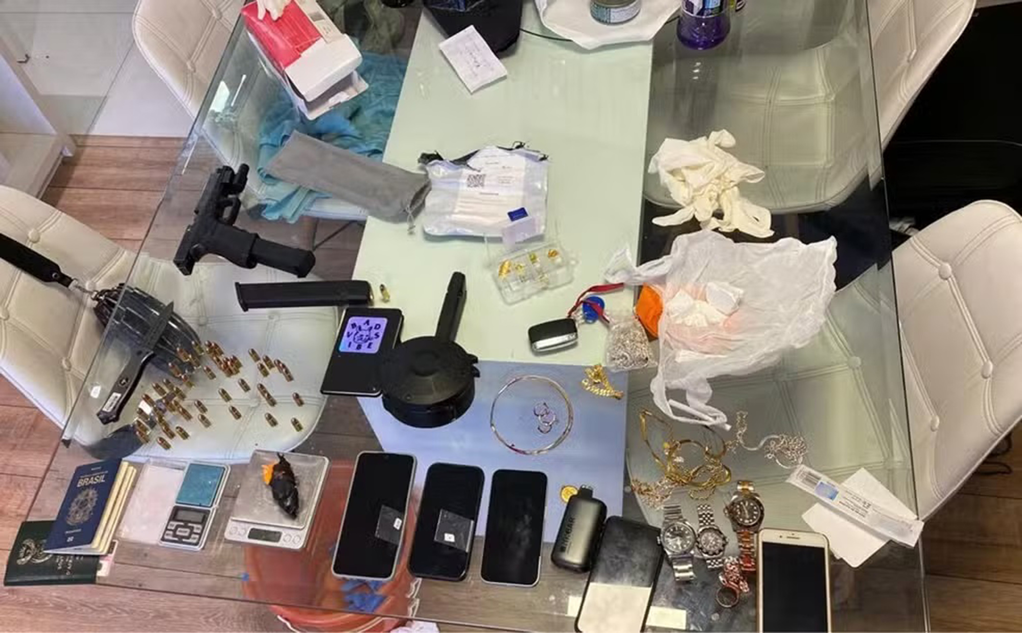 Picture shows items seized by police at the property where the foreign couple was found dead