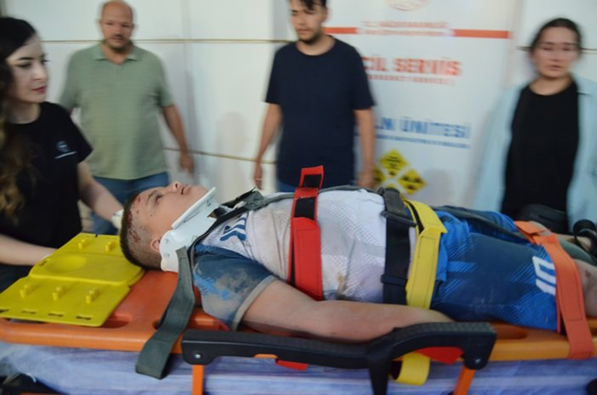 Picture shows rescuers carrying an injured person