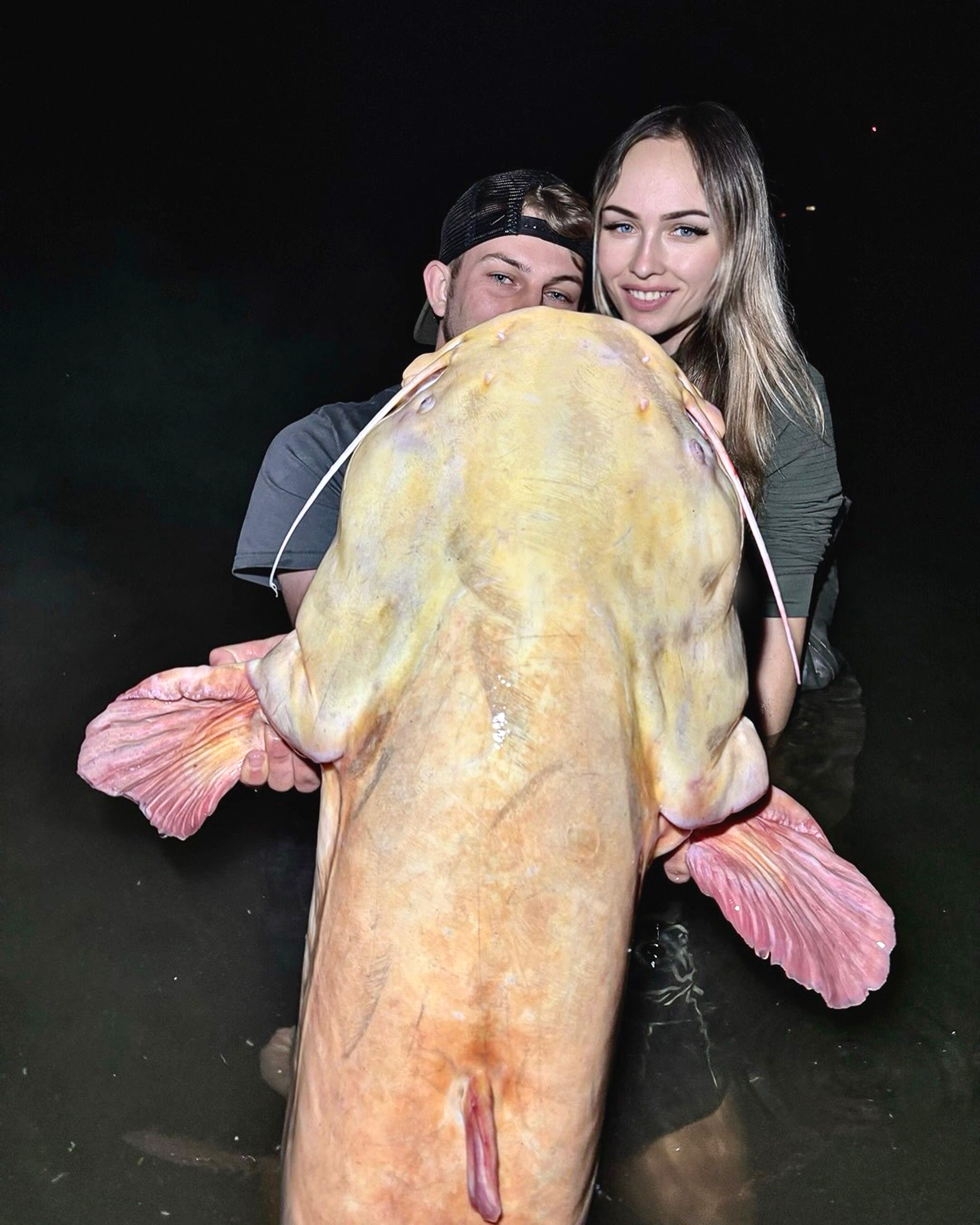Picture shows Stepan with his girlfriend Barbora and the fish