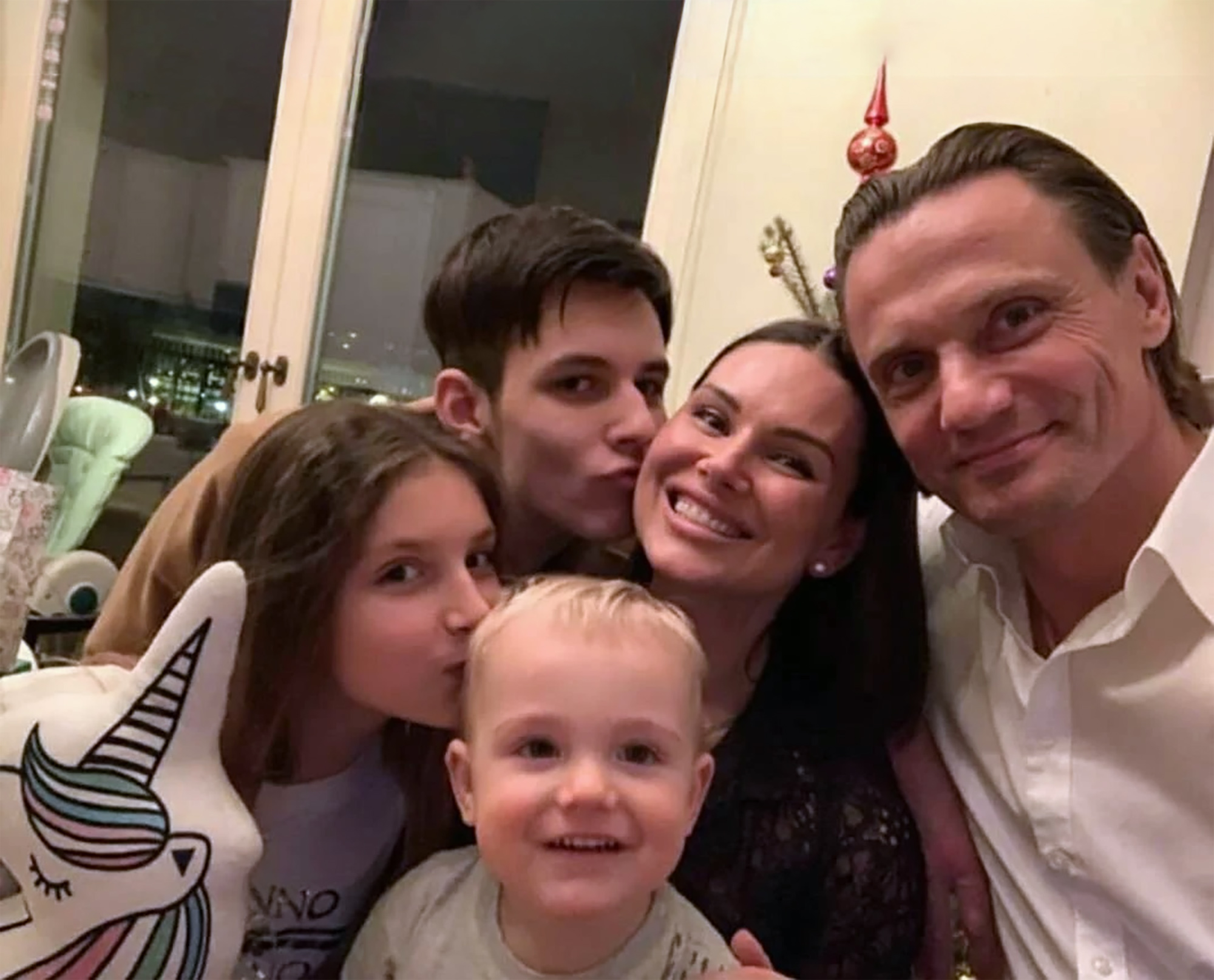 Photo shows the victim Irina Dvizova and the suspect Andrey Kuslevich with family,