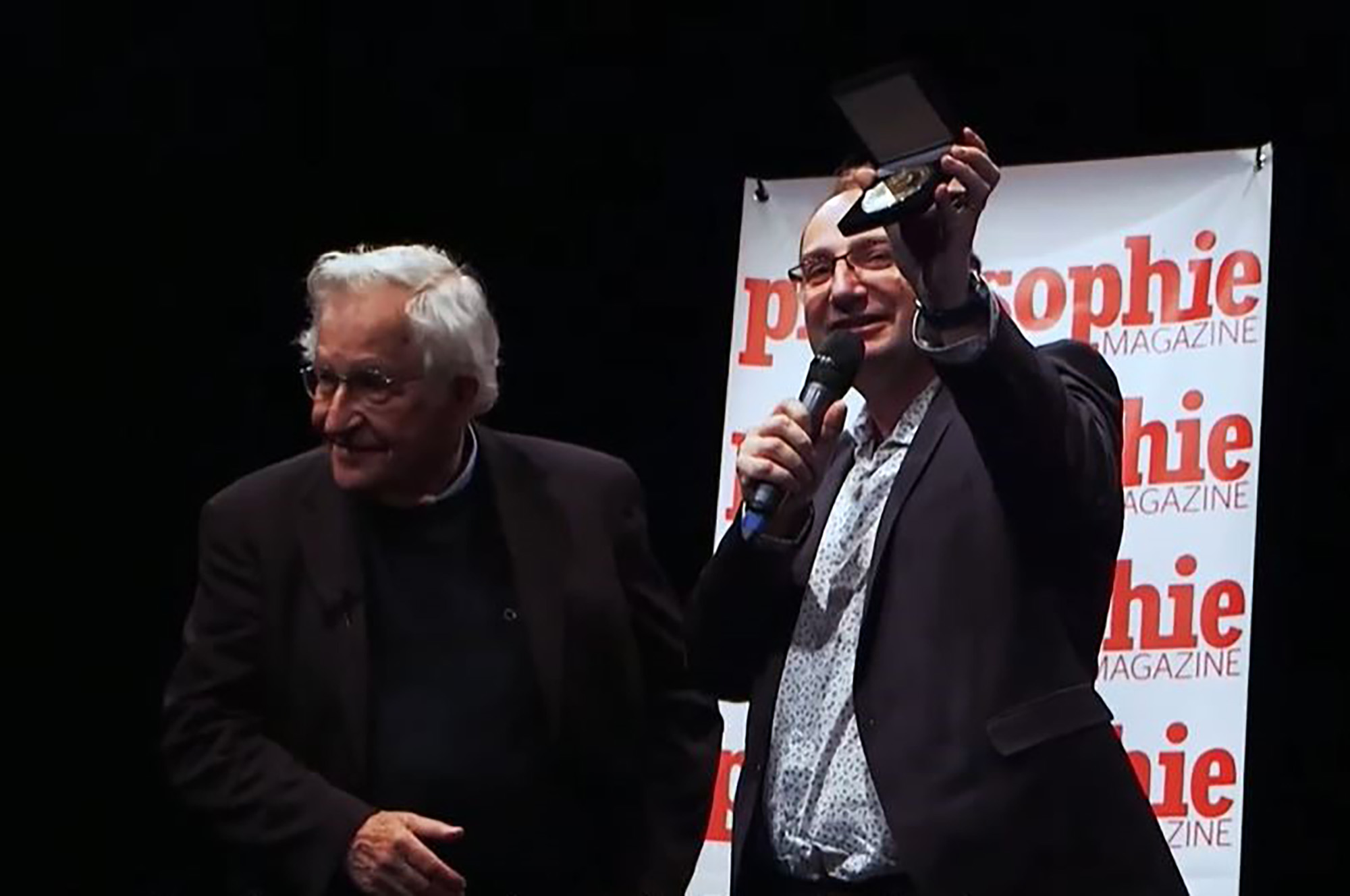 Florent Montaclair presents US linguist Noam Chomsky with gold medal in Paris on 30 November, 2016. Montaclair has been accused of fabricating the award. Note: Photo is a screenshot of a video. Florent Montaclair presents US linguist Noam Chomsky