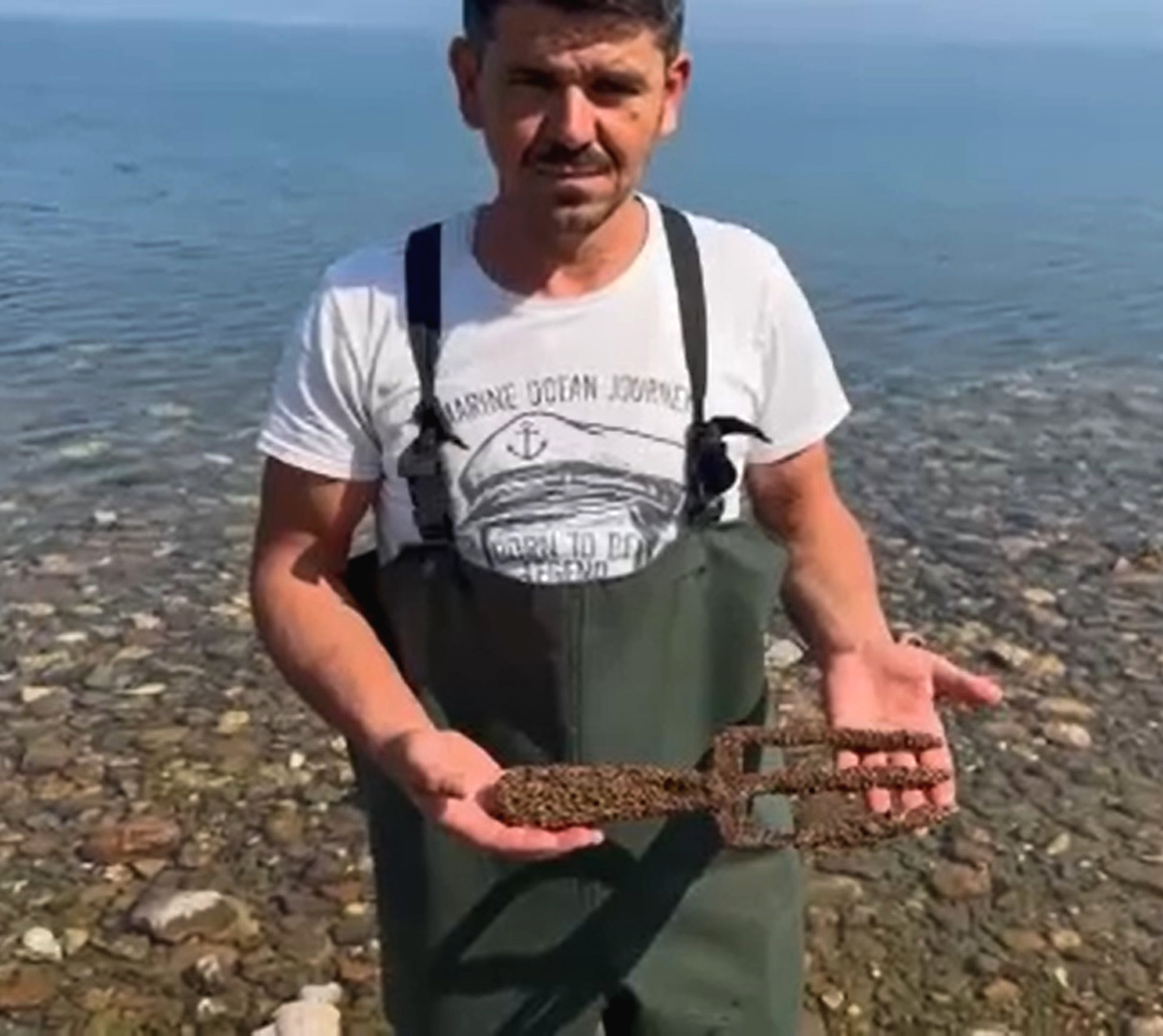 Picture shows a person holding the spearhead, known as the Poseidon Spear, undated. The item was found in a lake in Iznik, Turkey. 1747247856216-j5t7mt30.jpg