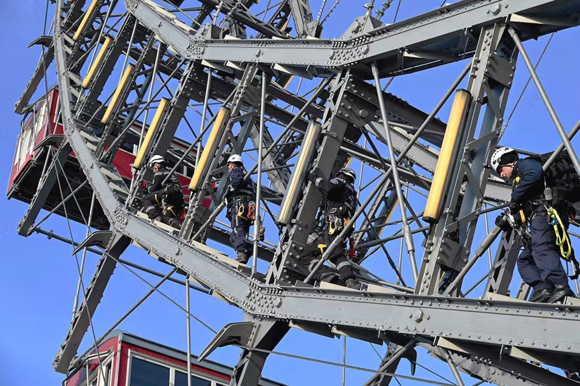 High-altitude rescuers perform an exercise, undated. Firefighters abseiled from the Vienna Giant Ferris Wheel as part of the exercise in Vienna, Austria, on May 14, 2025. Note: Firefighters photo taken from local media. 1747337339065-6qnmg9uk.jpg