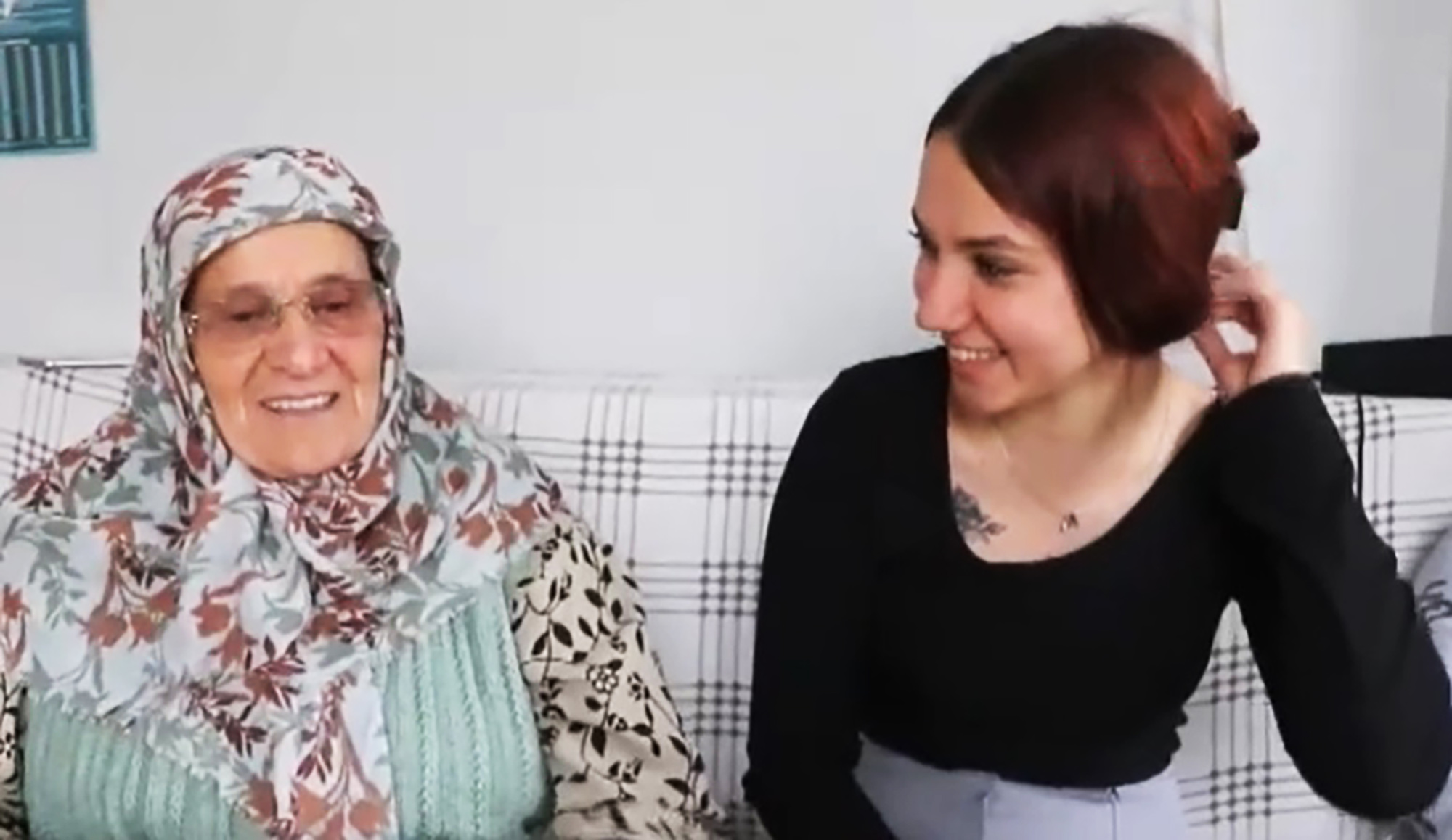 Picture shows Asiye Kaytan, 80, with granddaughter, undated. The elderly woman was sentenced to prison for hitting her in the arm with a slipper. Note: Image is a screenshot from video. (Newsflash/NX) 1747844474339-4g4ullbf.jpg
